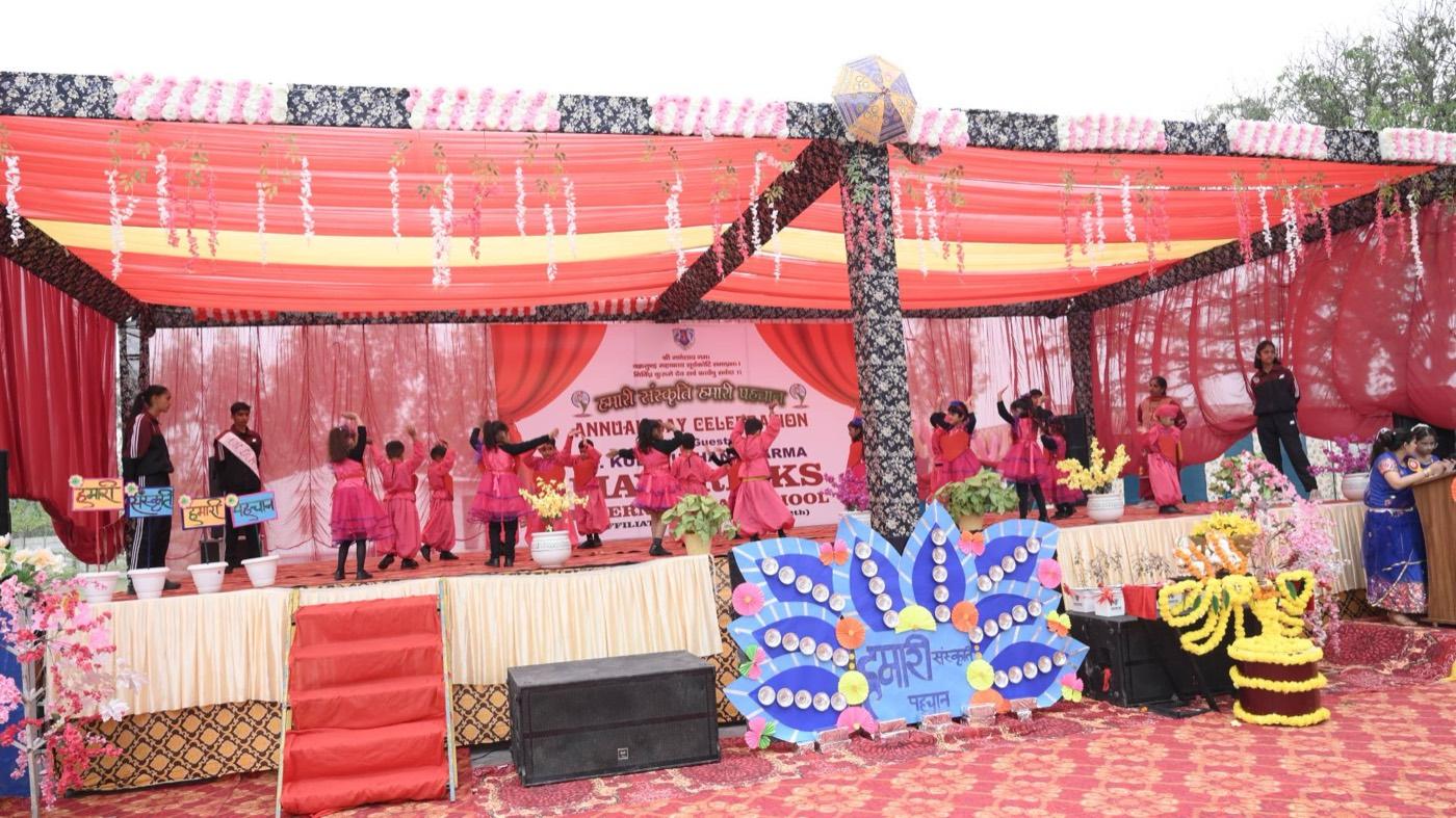 Children performing on stage at the Annual Day celebration
