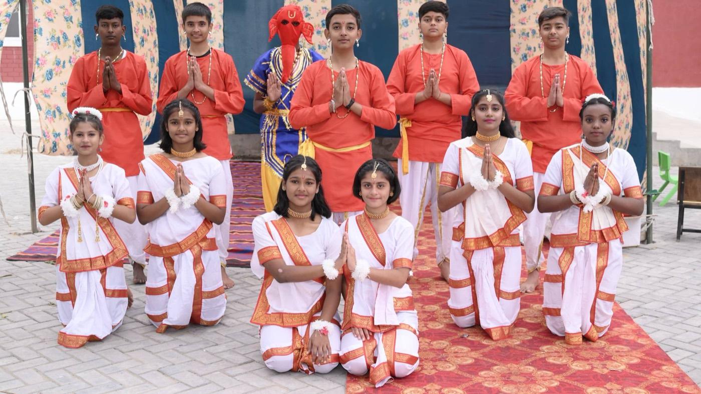 Students in costume performing at the Annual Day celebration